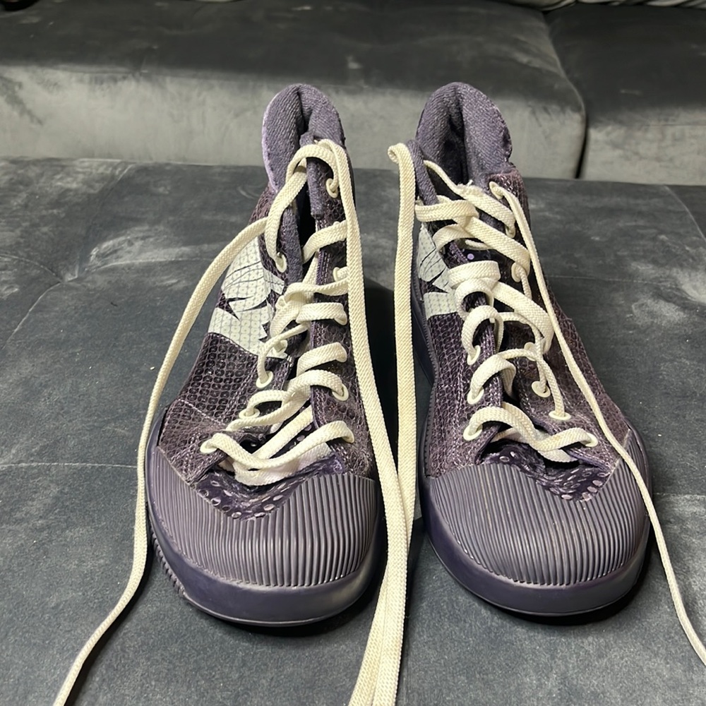 Nike tennis shoes with purple sparkle on the back
